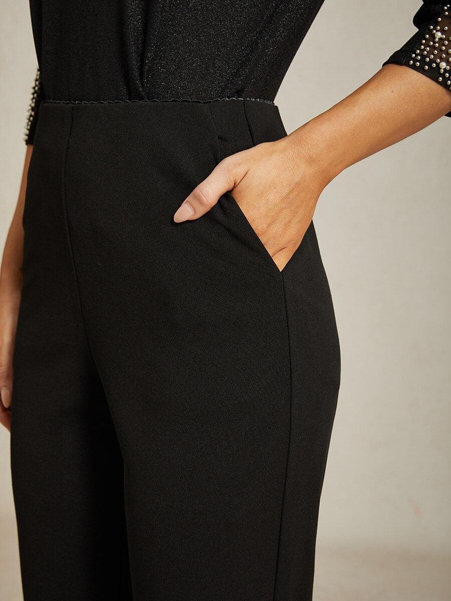 Pantalón negro de pierna estrecha con cintura elástica y bolsillos laterales - Nhaura