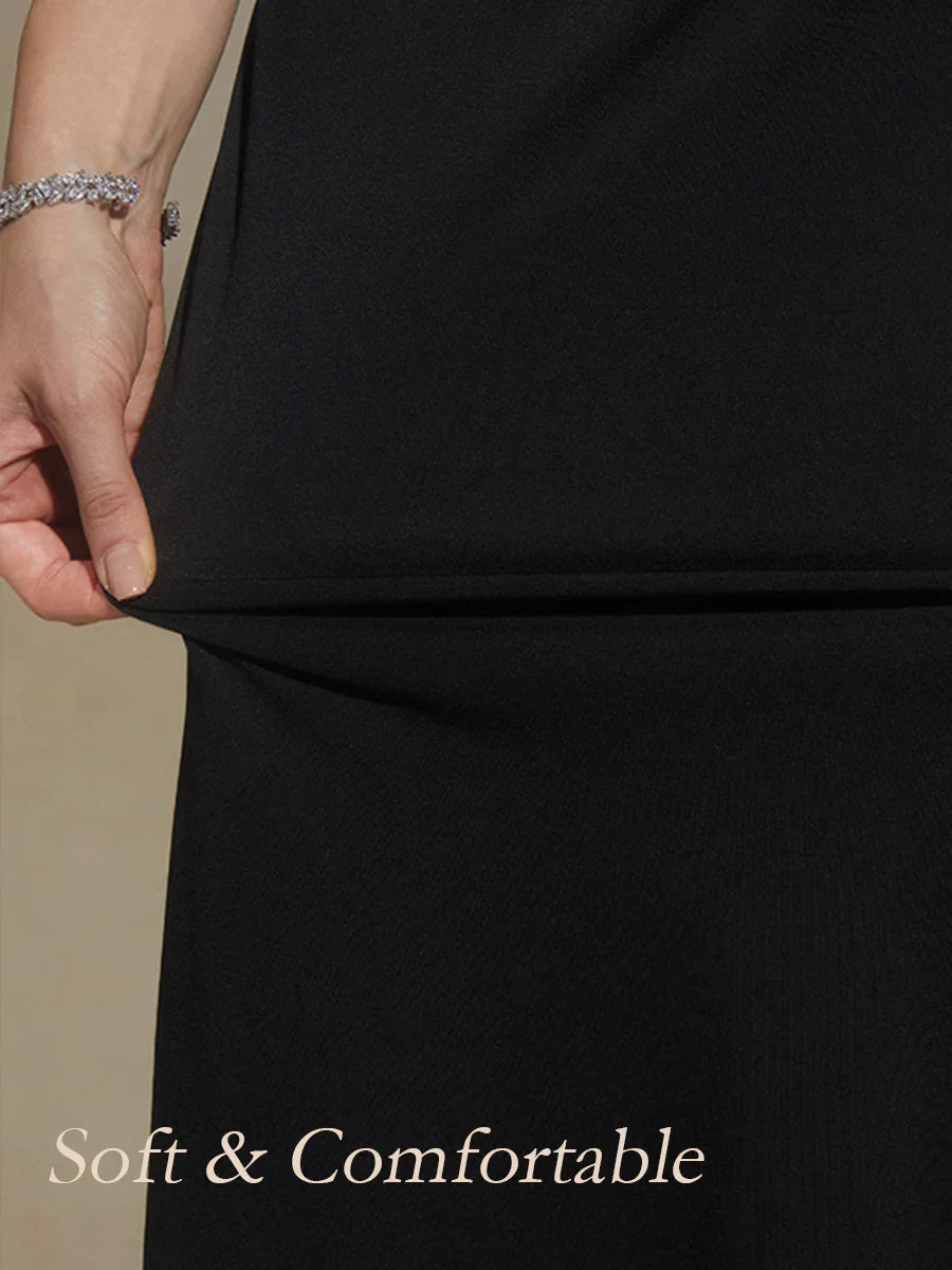Vestido negro evasé de punto con escote en V y detalle cruzado en la cintura - Nhaura